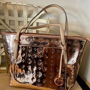 Michael Kors rose gold purse. New without tag